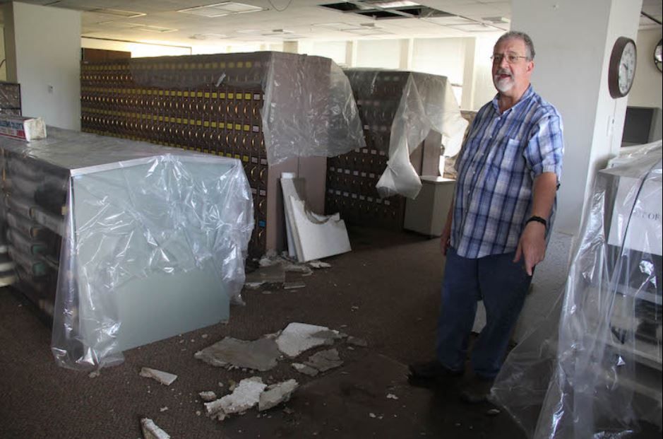 Greg Erpenbach, facilities superintendent for the Yellowstone County Courthouse, talks about flood damage in the clerk and recorder's office on the fourth floor. Ed Kemmick/Last Best News)